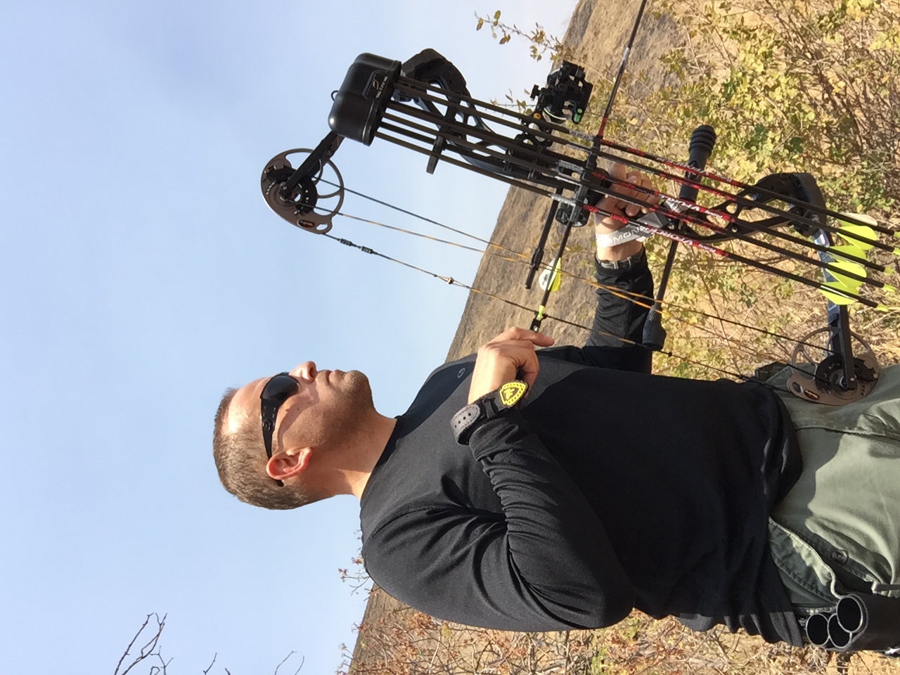 Andras with his compound bow outdoors